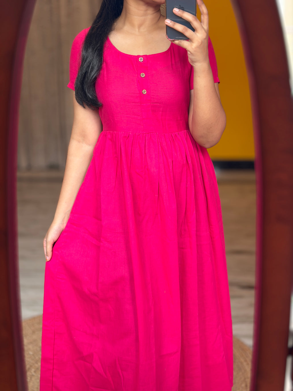 Maxi with openable buttons